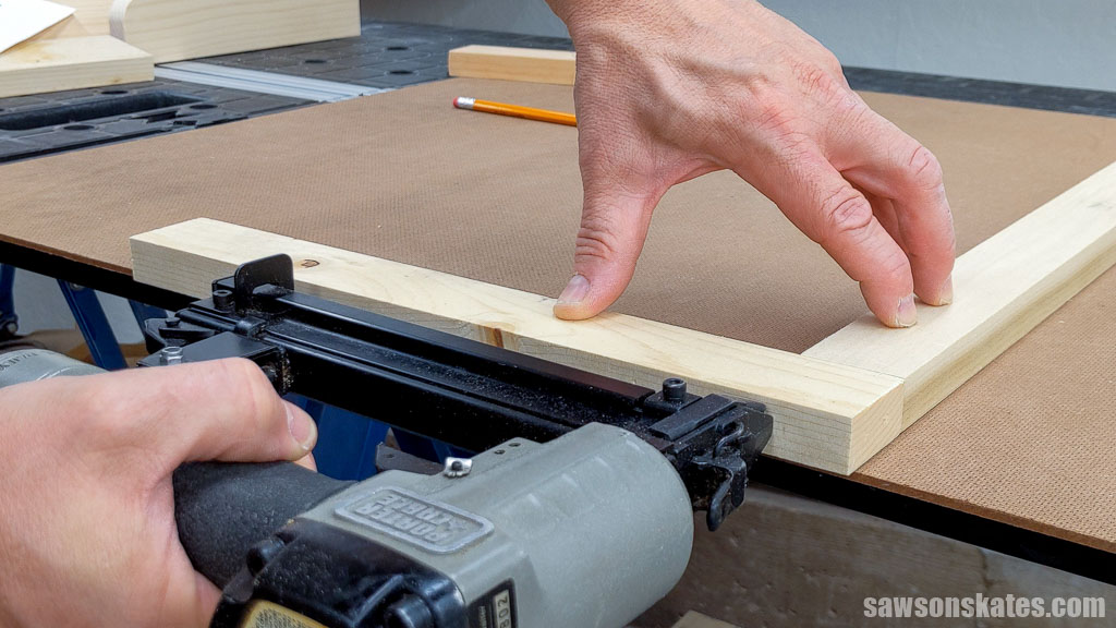 Using a brad nailer to assemble a frame