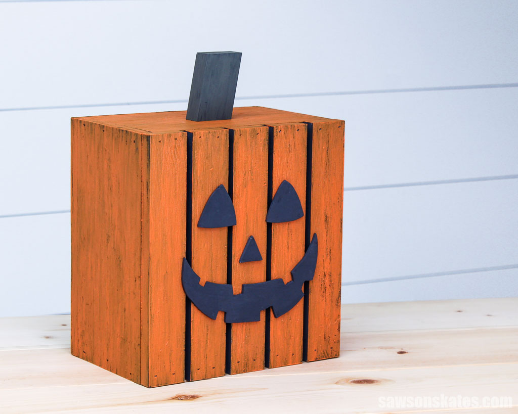 Side view of a small DIY jack-o-lantern on a table