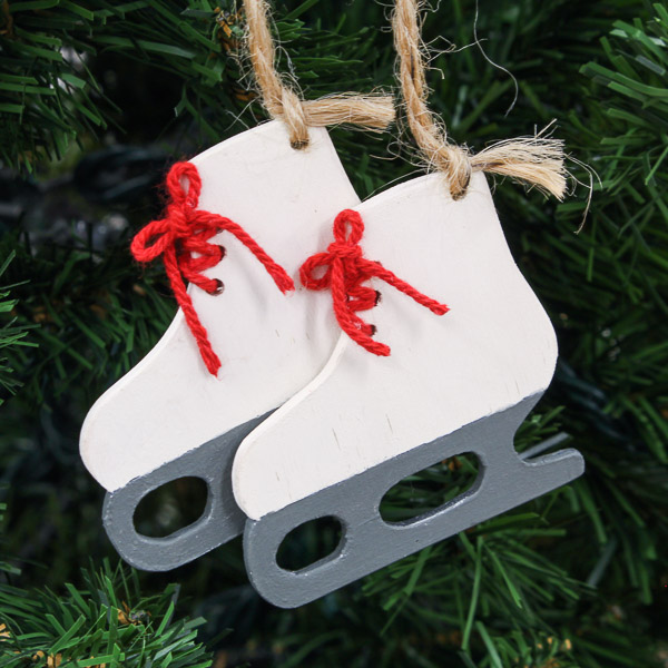 DIY ice skate ornaments hanging in a Christmas tree