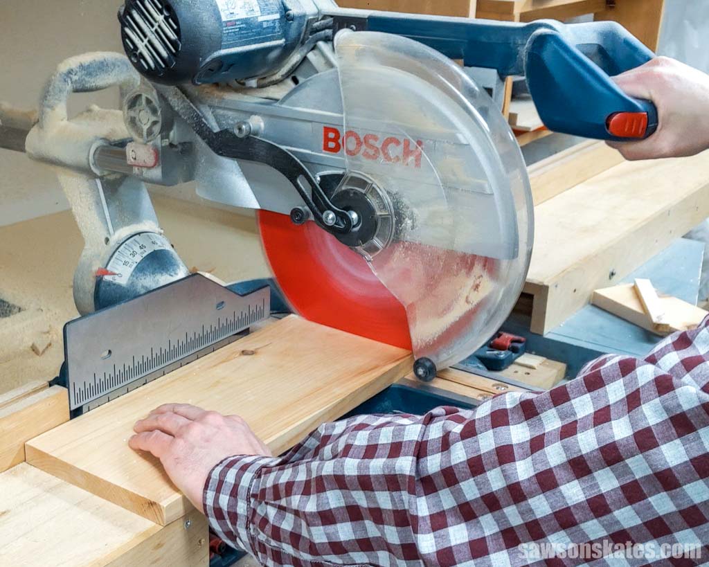 Crosscutting a board with a miter saw