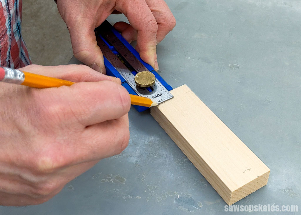 Using a pencil to layout a chamfered edge for a DIY phone holder
