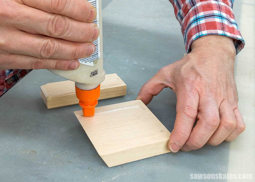 Applying glue to the top of a DIY phone holder