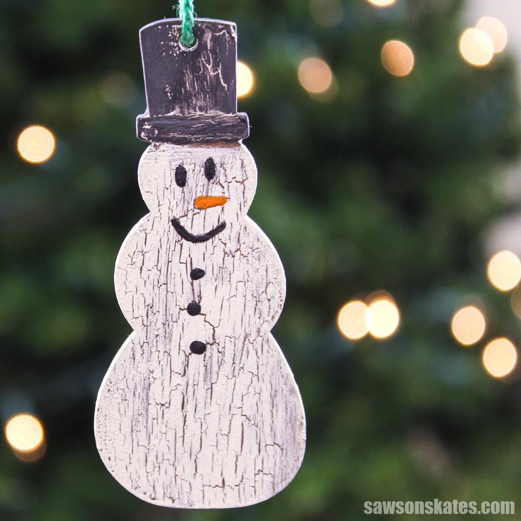 Hand painted DIY wooden snowman ornament with green string hanger