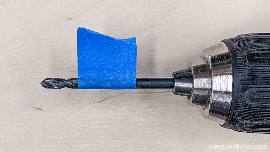Blue painter's tape wrapped around a drill bit as a depth stop