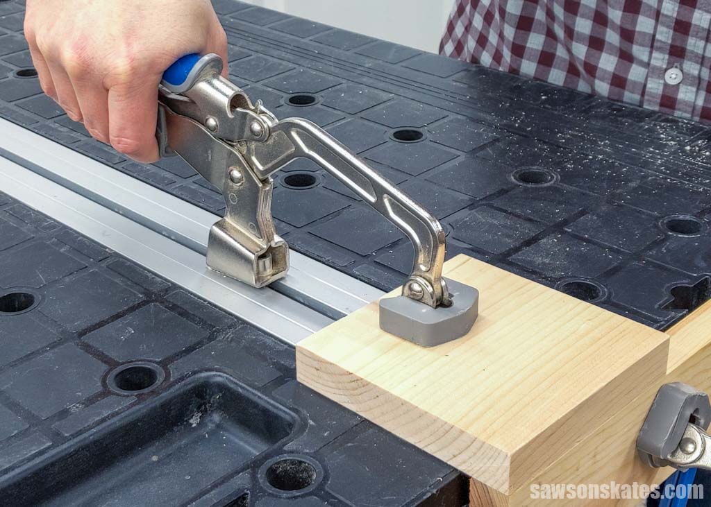 Hand clamping a board to a workbench
