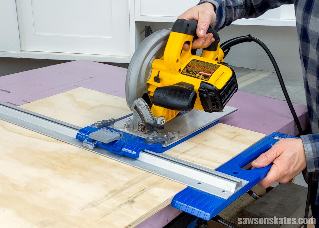 Rip cutting a piece of plywood using a circular saw and Kreg Rip-Cut