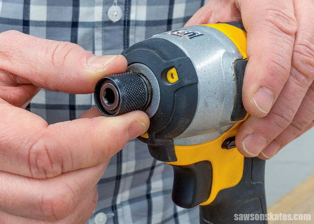 Fingers gripping a impact driver's collet