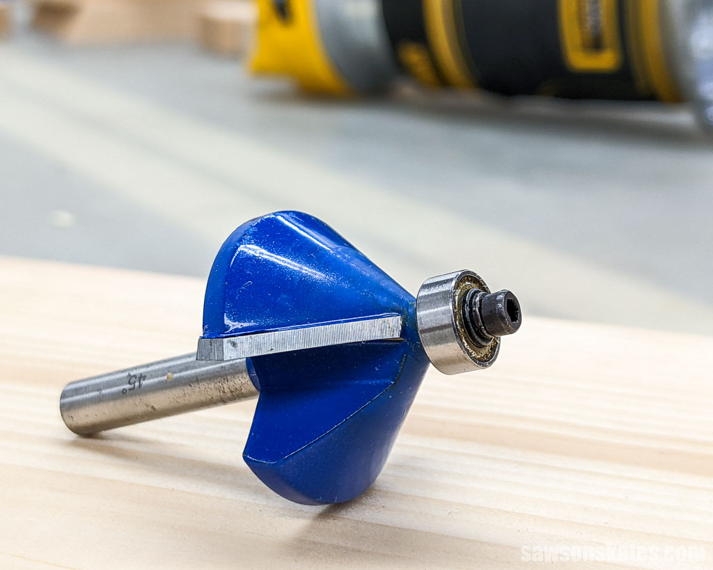 Chamfer router bit on a piece of wood
