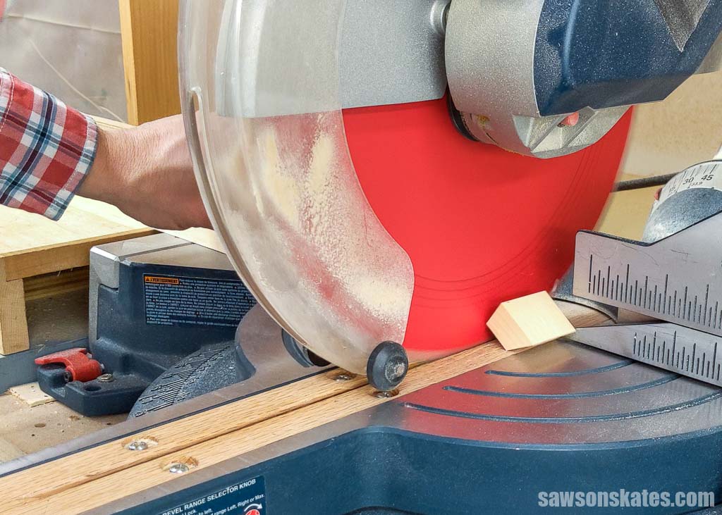 Cutting a board to length with a miter saw