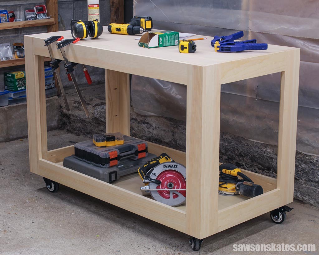 DIY workshop utility cart with tools on the top and bottom shelves