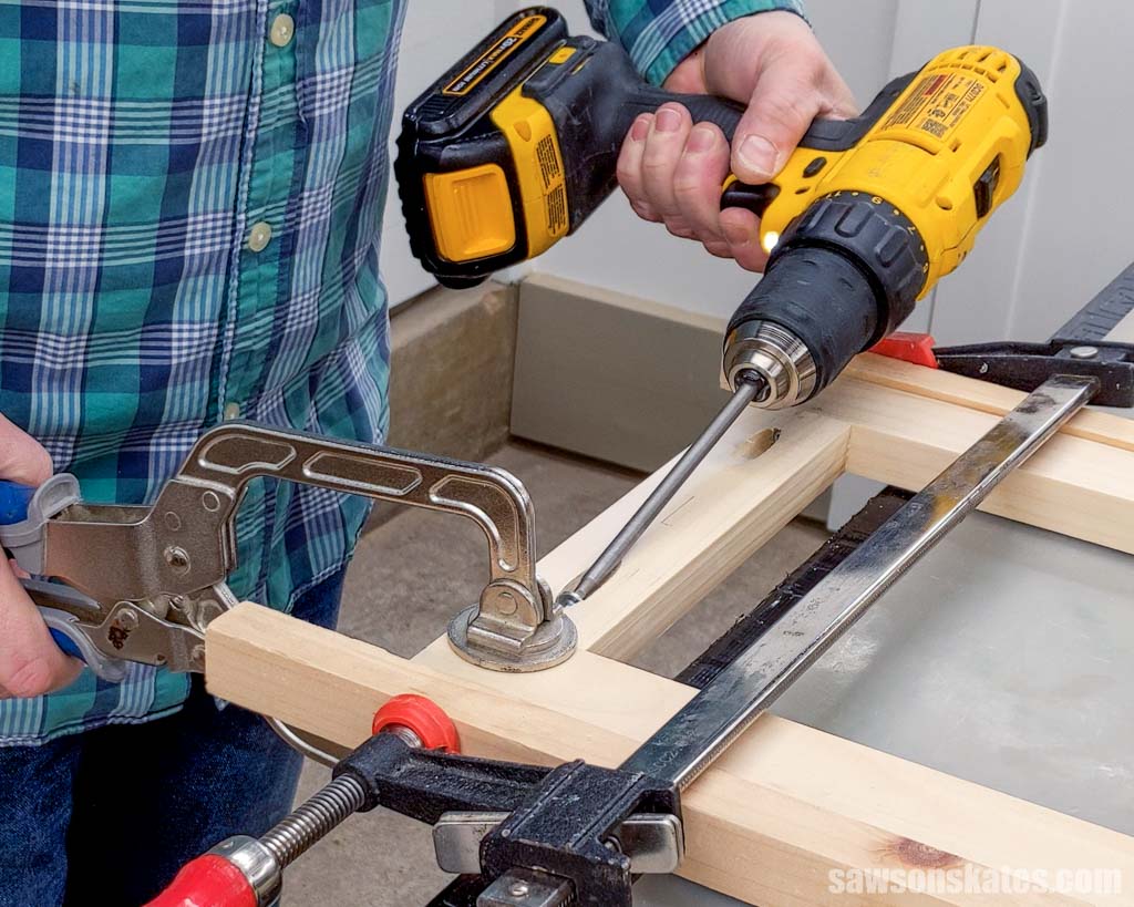 Using a drill to drive a fastener into wood