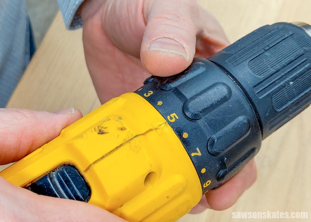Hand adjusting a drill's torque setting