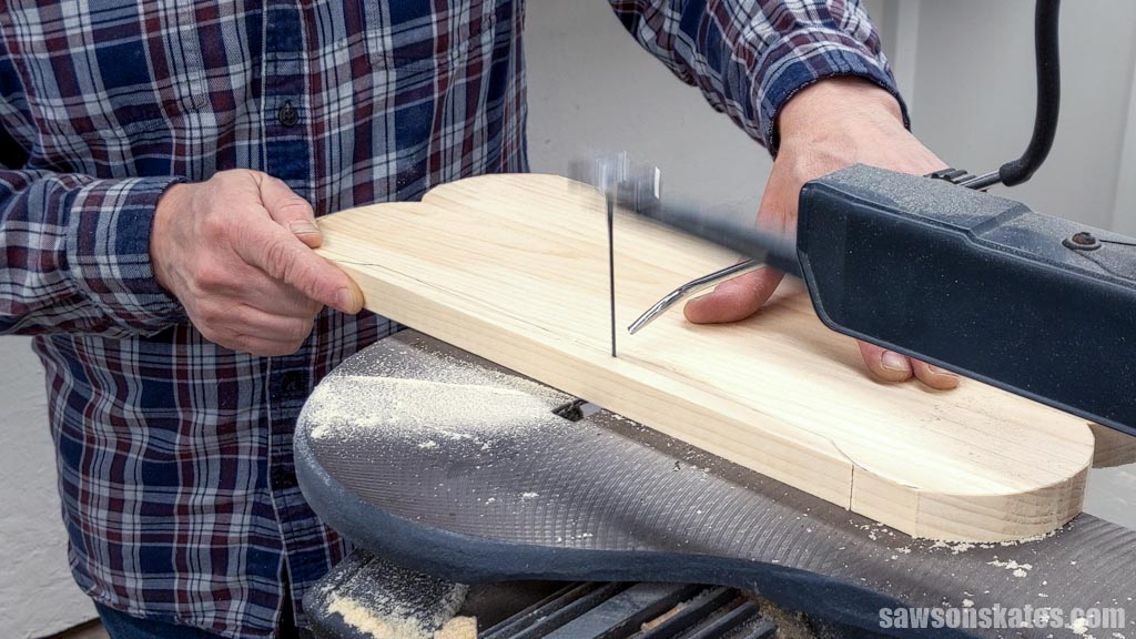 Using a scroll saw to cut a bone-shaped top for a DIY dog bowl stand