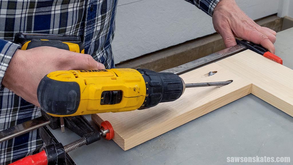 Using a drill to drive a pocket screw into a pocket hole