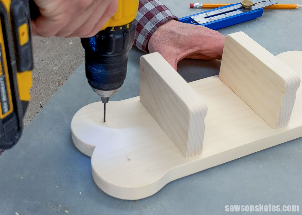 Using a drill to make a pilot hole