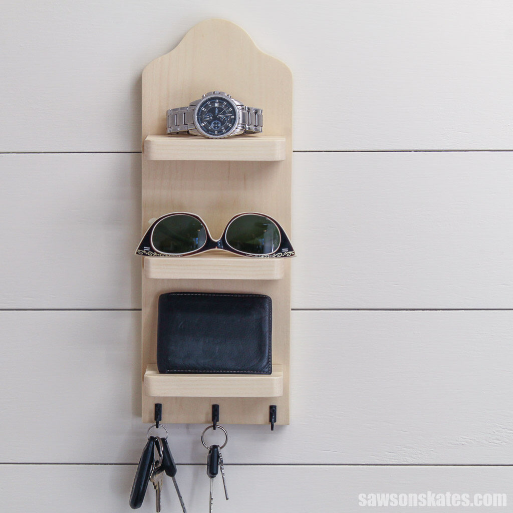 Front view of a DIY wall-mounted key holder with shelves