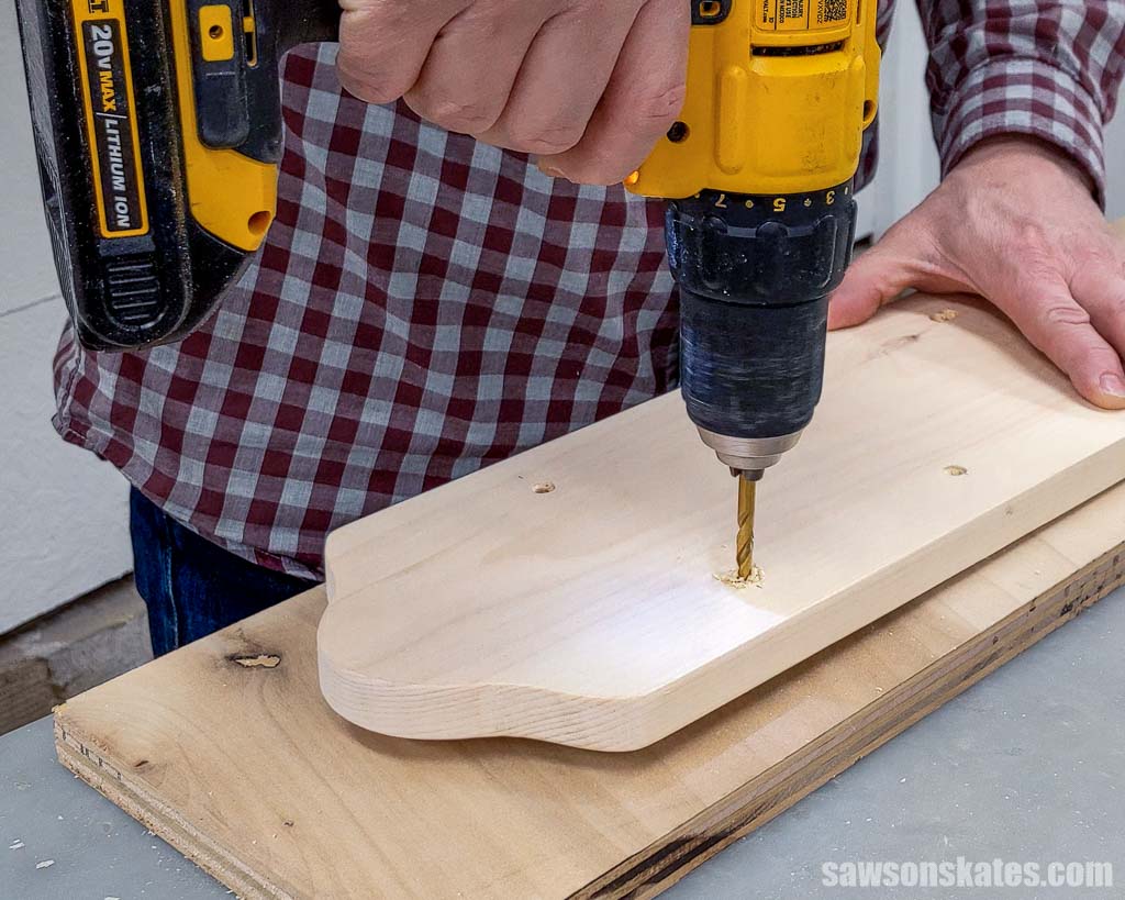 Making a hole in a board with a drill bit
