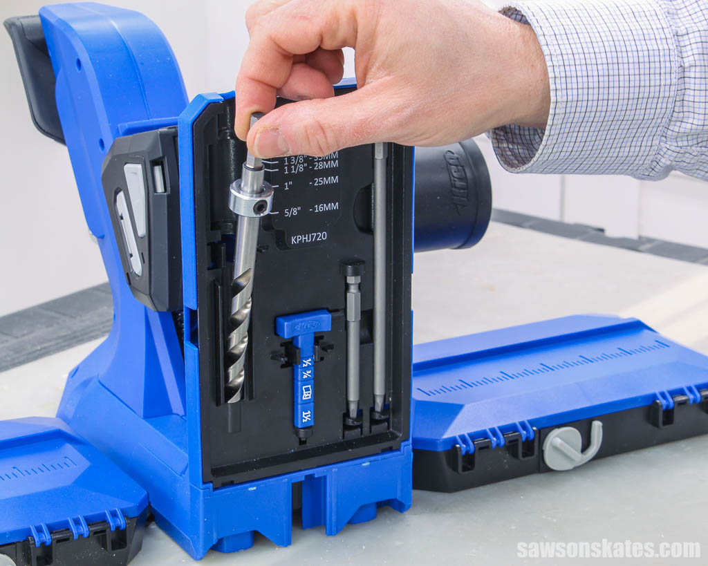 Placing a drill bit into the storage area of a Kreg Jig 720PRO