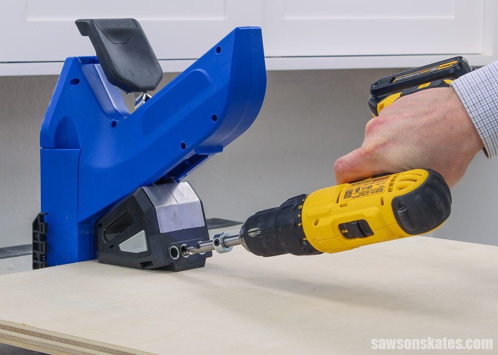 Using the Kreg Jig 720 in the horizontal position to drill pocket holes on a plywood sheet