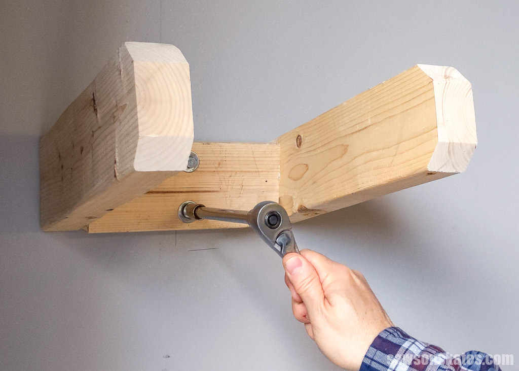 Attaching DIY ladder storage hooks to a wall with lag screws