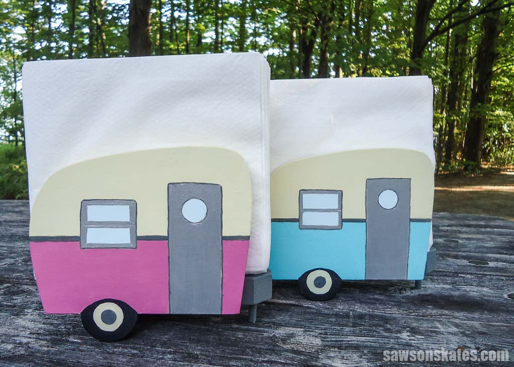 Pink and blue DIY vintage camper napkin holders on a picnic table