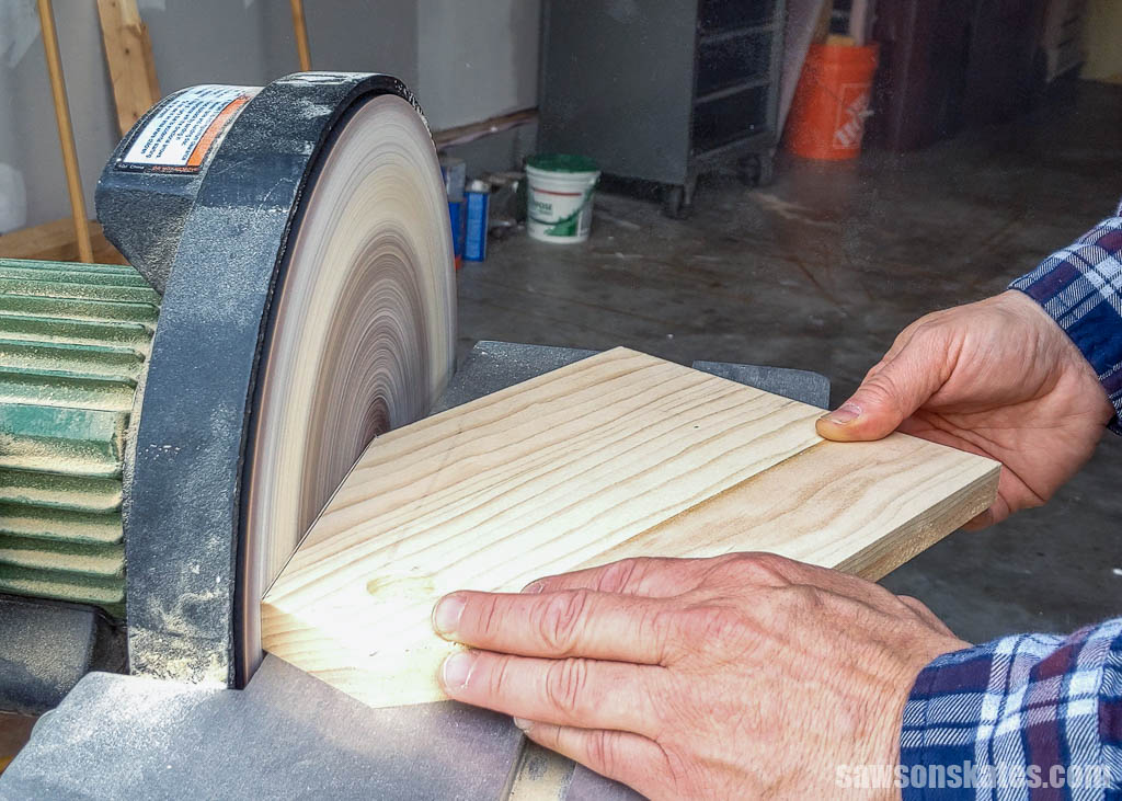 Sanding an angled edge with a disc sander
