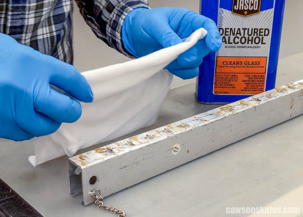 Using denatured alcohol to remove wood glue from a clamp