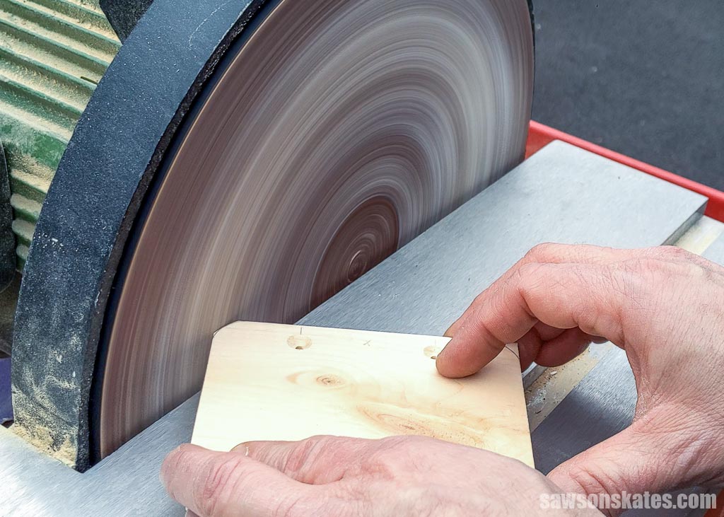 Rounding a board's corner with a disc sander