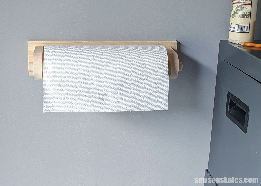 Front view of a DIY workshop paper towel holder mounted on a wall