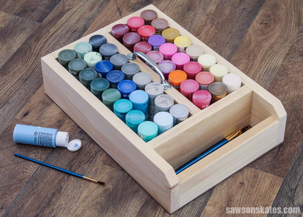 A beginner=friendly craft paint organizer filled with colorful paints