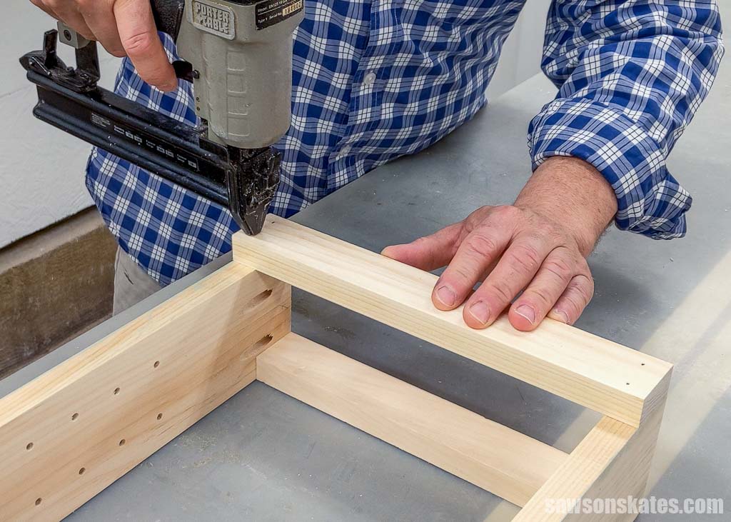 Using a brad nailer to attach the front rail