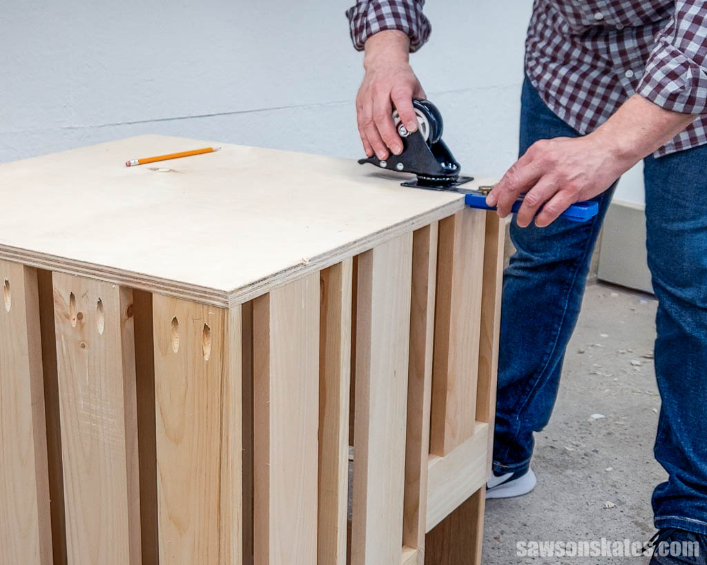 Using a Kreg Multi-Mark to position a caster on the bottom of a DIY small lumber cart