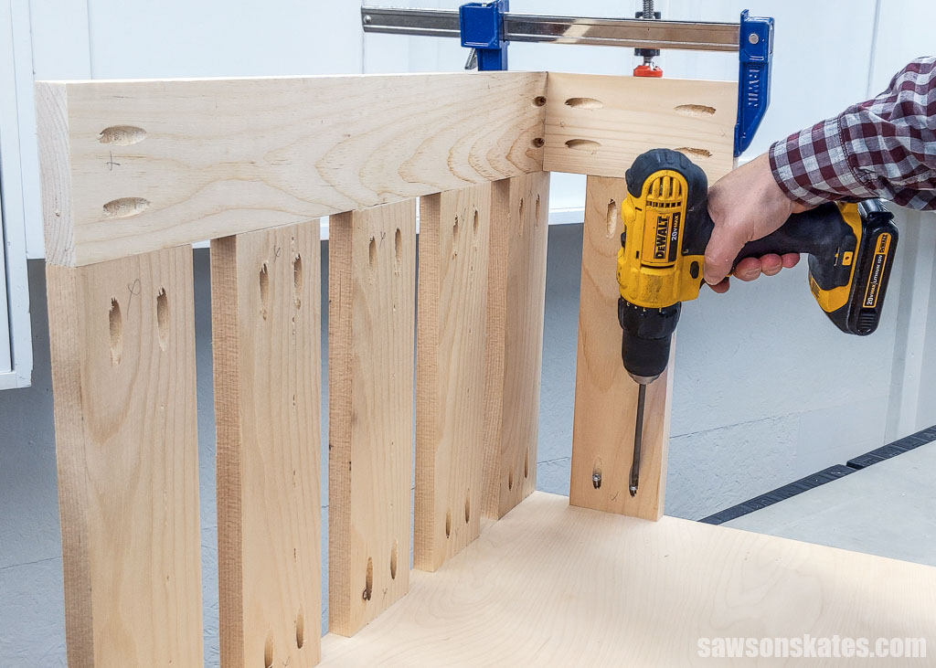 Attaching a side slate to a DIY lumber cart's plywood bottom
