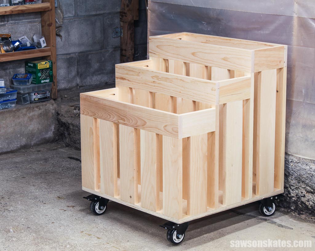 An empty space-saving DIY lumber on wheels in a workshop