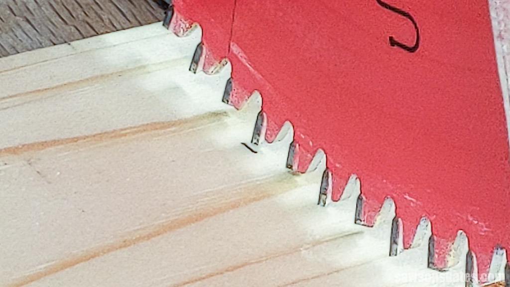 Blade positioned with its kerf on the waste side of a board to be cut