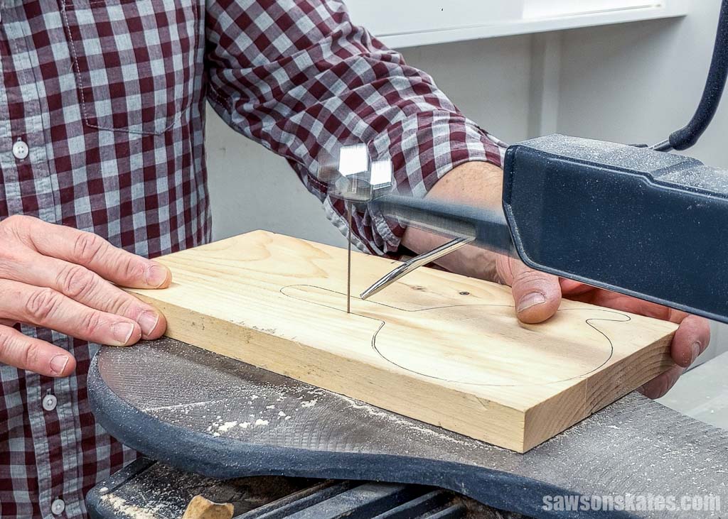 Cutting out a handheld hook-and-ring game using a scroll saw