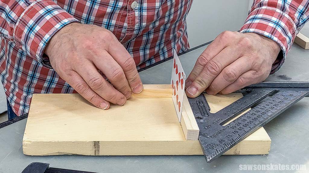 Using a speed square to position a narrow piece of wood
