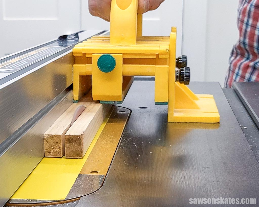 Using a push block to rip narrow strips on a table saw