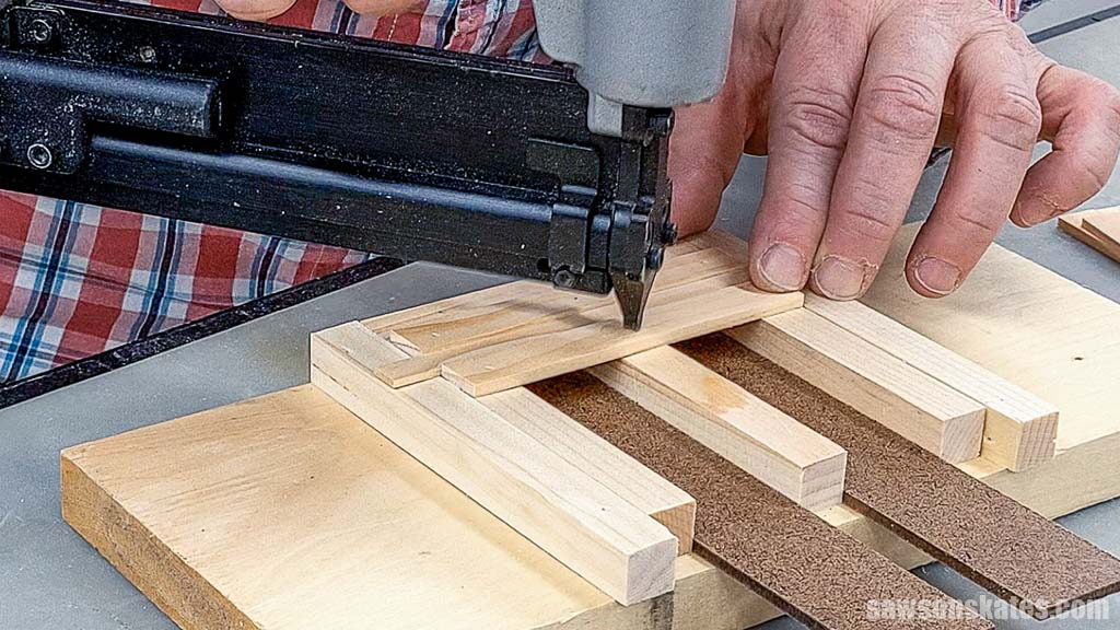 Attaching a second deck board with a pin nailer for a DIY mini pallet coaster