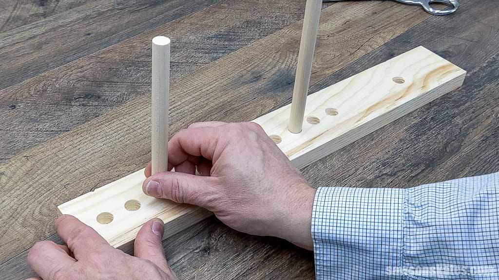 Inserting a dowel in a DIY bow maker's wood base