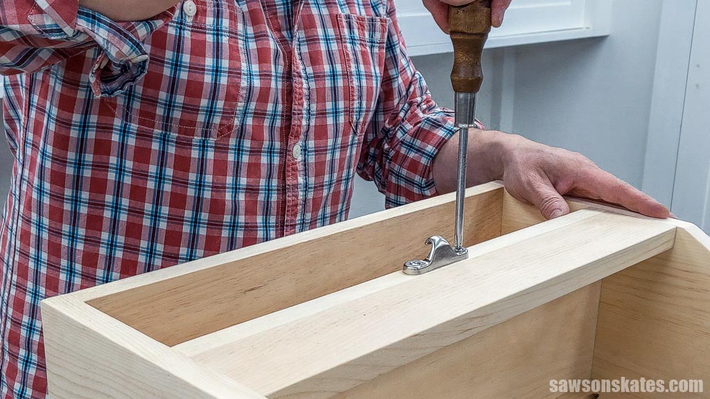 Attaching a sash lock keeper to a DIY toolbox with screws