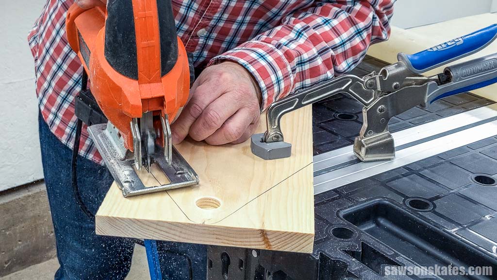 Using a jigsaw to cut out a DIY toolbox's side