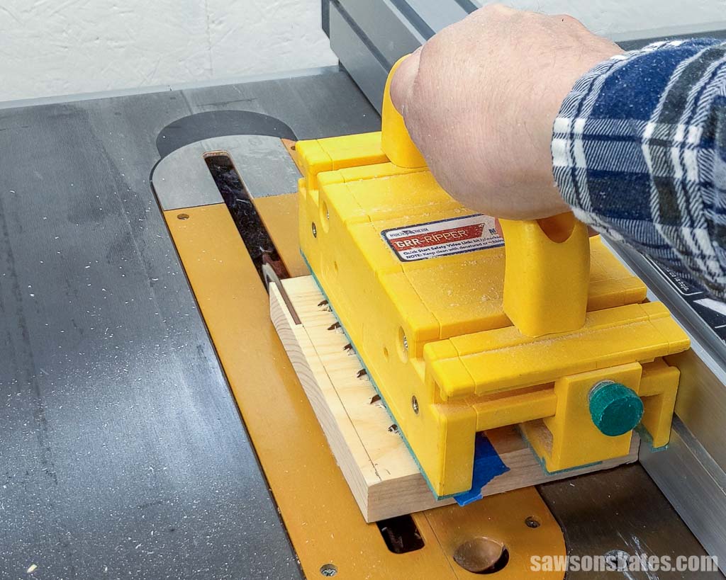 Using a table saw to release pocket hole plugs from a board