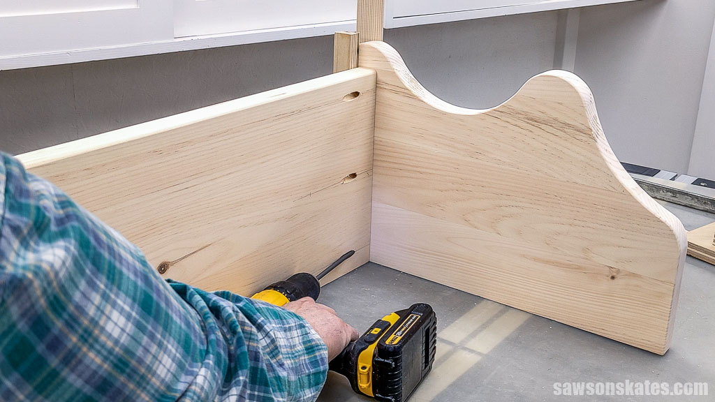 Attaching a shelf to a DIY kitchen shelf's side panel with pocket hole screws