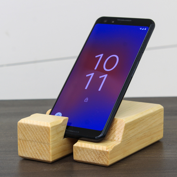 DIY wood phone holder on a table