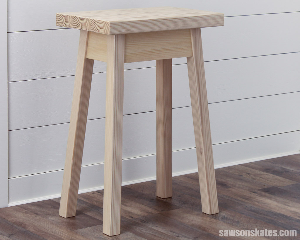 Looking at the side of a rustic DIY bedside table made with inexpensive 2×4s