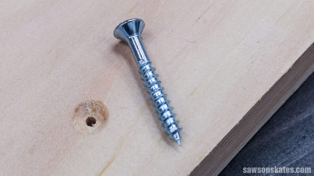 Wood screw next to a countersink hole