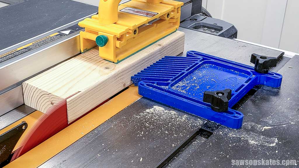 Showing where to position a featherboard on a table saw