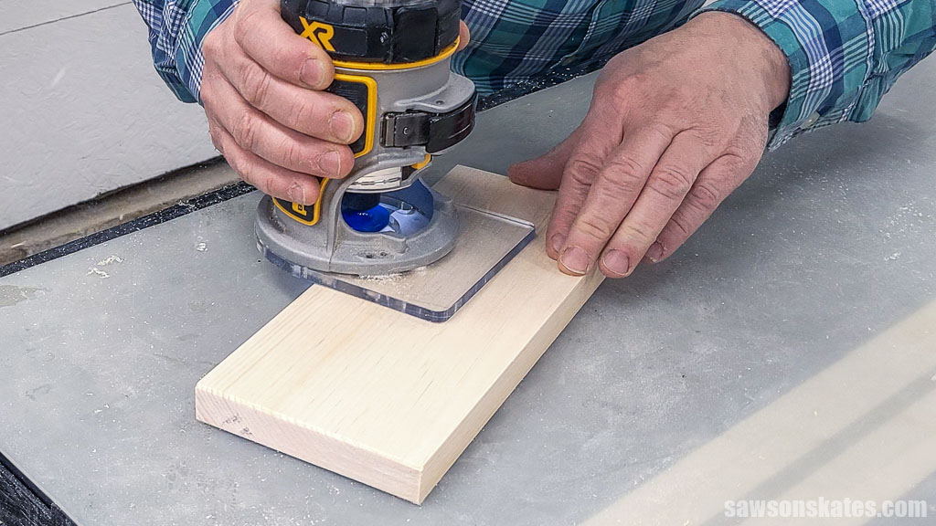 Using a chamfer bit to bevel a key cabinet's top