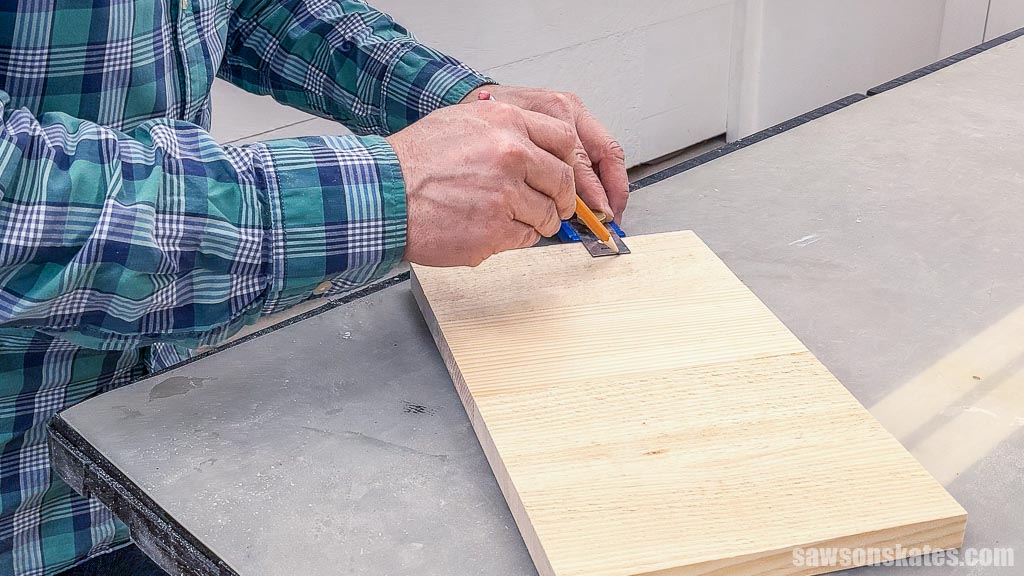 Marking pocket hole locations on a back panel for a key holder cabinet